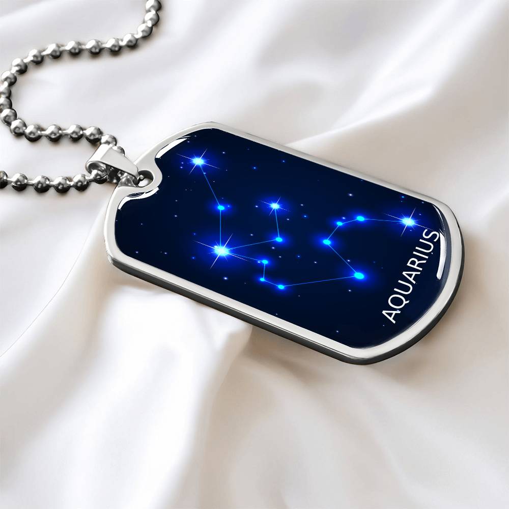 Aquarius blue constellation necklace laying on a white sheet