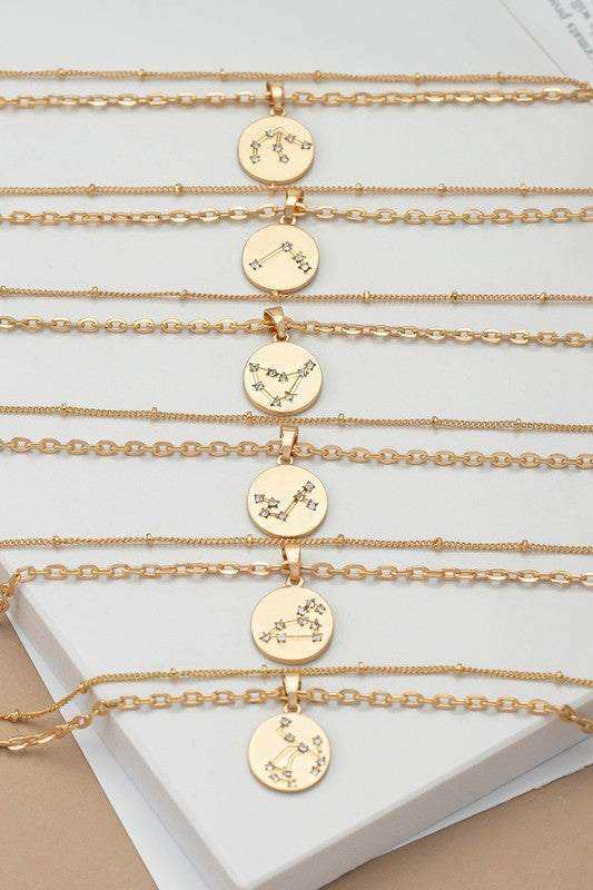 Zodiac Constellation Necklaces lined on table bottom 6